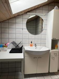 a bathroom with a sink and a mirror at Cozy Apartment in Billund in Billund