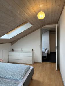 a bedroom with a bed and a mirror at Cozy Apartment in Billund in Billund