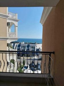 a balcony of a building with a view of a parking lot at Vila Antorini-Anikoapartman 2 in Sveti Vlas