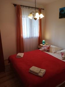 Postel nebo postele na pokoji v ubytování Apartmani Vitković II Cres