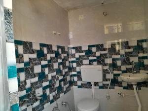 Kopalnica v nastanitvi Satwik Homestay