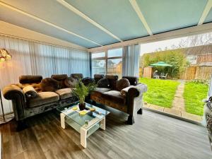 a living room with a couch and a table at Pass the Keys A BeachhouseHome away from Home in Clacton-on-Sea