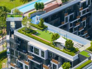 an overhead view of an apartment building with a garden on the roof at Skypark Laguna Rooftop Pool Apartment near Bang Tao Beach in Bang Tao Beach