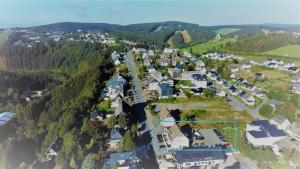 an aerial view of a small town with houses at Die zwei Löwen Ferienwohnungen in Winterberg +213 photos