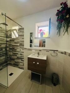 a bathroom with a sink and a shower at Casa La Radio in Anacapri +17 photos