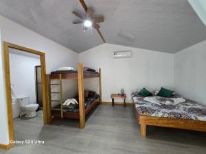 Ένα ή περισσότερα κρεβάτια σε δωμάτιο στο Casita Sol y Mar