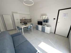 a living room with a couch and a table at Il Narciso Residence in Tropea