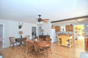 a kitchen and living room with a table and a dining room at Bear Necessities -Forget your Worries! in Great Cacapon +22 photos