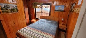 Postel nebo postele na pokoji v ubytování Cabañas Buen Recuerdo