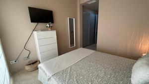 A bed or beds in a room at Luxury Homes Valle Del Este Resort Golf And Spa Vera, Garrucha, Mojacar