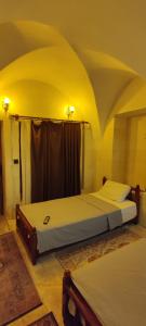 Llit o llits en una habitació de Ktisis Butik Otel