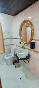 a bathroom with a toilet and a mirror at Ktisis Butik Otel in Urfa