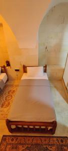 a bedroom with two beds in a room at Ktisis Butik Otel in Urfa