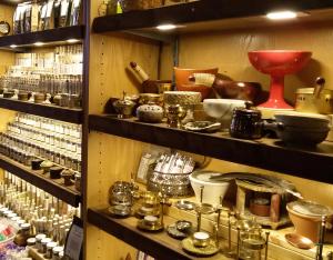 a shelf filled with lots of items in a store at LiebesNesterl Bergwirt - Boutique Hotel in Köflach