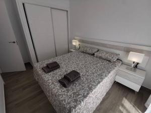 מיטה או מיטות בחדר ב-La Perla de Monte y Mar
