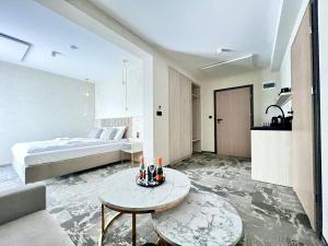 a bedroom with a bed and a table in a room at SILVER BALTIC in Kołobrzeg +82 photos