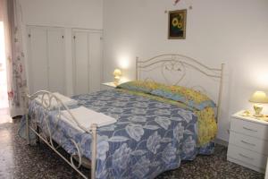 Ένα ή περισσότερα κρεβάτια σε δωμάτιο στο La casa dei Marinai +15 φωτογραφίες