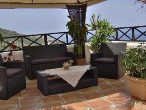 a living room with couches and a table on a patio at Ferienwohnung für 2 Personen ca 50 m in Icod de los Vinos, Teneriffa Nordküste von Teneriffa in Icod de los Vinos +12 photos