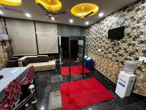 a conference room with a table and a red carpet at wide Hotel in New Delhi