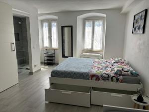 En eller flere senge i et værelse på Chez Ary: Sulla strada del Lago