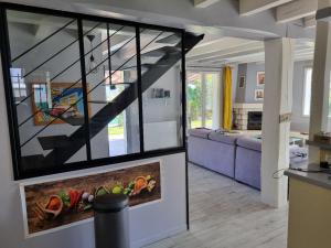 a living room with a staircase in a house at Maison - Ustaritz - proche Biarritz in Ustaritz