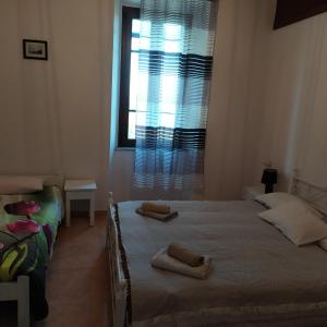A bed or beds in a room at Nymph
