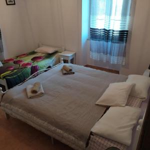 A bed or beds in a room at Nymph