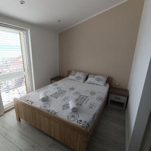 Postel nebo postele na pokoji v ubytování Apartmani Kristijan