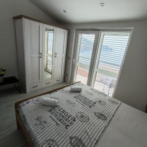 Postel nebo postele na pokoji v ubytování Apartmani Kristijan