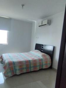 Ein Bett oder Betten in einem Zimmer der Unterkunft Apartamento mirador de la sierra 2