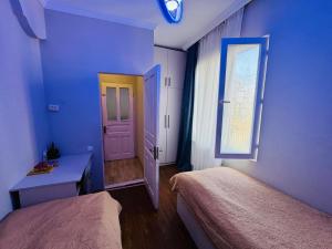 Ένα ή περισσότερα κρεβάτια σε δωμάτιο στο Ios Guest House