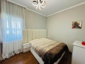 Ένα ή περισσότερα κρεβάτια σε δωμάτιο στο Ios Guest House