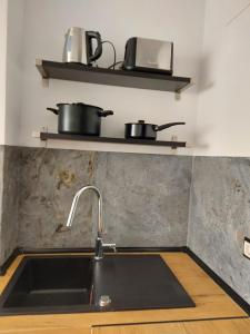 a kitchen with two pots and a sink at Benidorm playa poniente in Benidorm