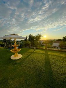 a yellow umbrella sitting in the middle of a field at Nikitihouse Apartments 2 in Nikiti