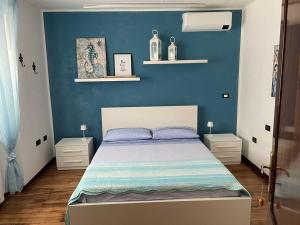 A bed or beds in a room at Casa Camilla