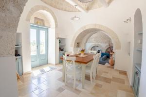 Posezení v ubytování Trullo Dimora Podere Papilio