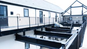 a balcony of a building with snow on the ground at 1BR Sleeps 4, 3 mins from City centre & Local Gems in Burton upon Trent