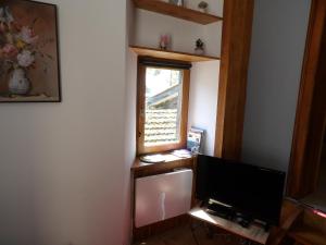 TV a/nebo společenská místnost v ubytování Studio à Murbach au calme