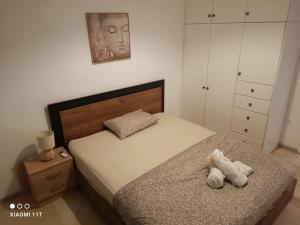 A bed or beds in a room at Crystal Cannon Apartment (Travel2Corfu)