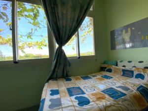 Postel nebo postele na pokoji v ubytování 豐綠民宿 Yilan Fenglu Homestay