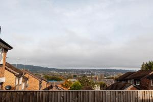 a view of a town with houses and a fence at The Nest at Blackburn in Cherry Tree