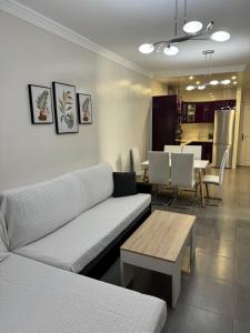 a living room with a couch and a table at Apartamento Corralejo in Corralejo