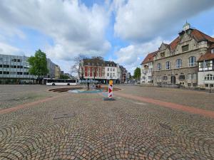 a street in a city with buildings at SFN Home Stay in Bergisch Gladbach