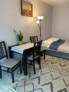 Posteľ alebo postele v izbe v ubytovaní Apartament Łagiewniki Krakow