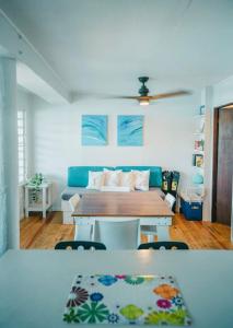 a living room with a table and a couch at Ocean Front Villa 3 in Culebra