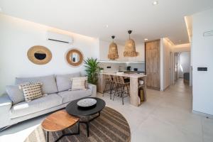a living room with a couch and a table at Casa Breca in Puerto del Carmen +41 photos