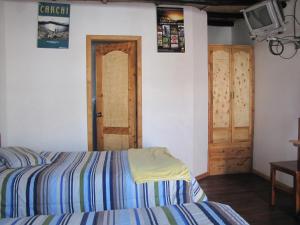 A bed or beds in a room at Cabañas Los Volcanes