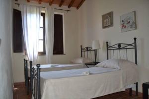 Postel nebo postele na pokoji v ubytování Ferienwohnung für 6 Personen ca 80 qm in Casalappi, Toskana Etruskische Küste