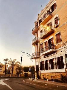 a building with a sign on the side of it at Alam B&B Luxor in Luxor