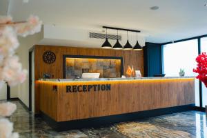 a reception desk in a lobby with a reception counter at Berlin Suite Hotel Trabzon in Trabzon +63 photos